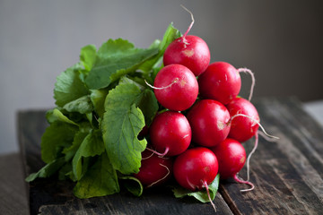Fresh radishes on old wood