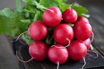Fresh radishes on old wood
