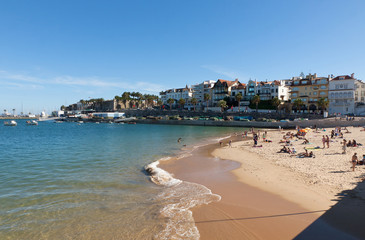 Fototapeta na wymiar People sunbathing on the beach in Cascais, Portugal