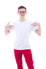 young man in blank t-shirt pointing at himself isolated on white