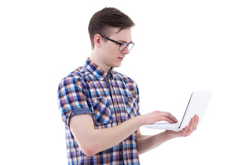 handsome teenage boy using laptop isolated on white