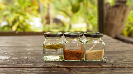 Thai condiment set in the glass bottle 