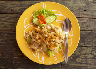 Thai style fried noodle with chicken selective focus from top