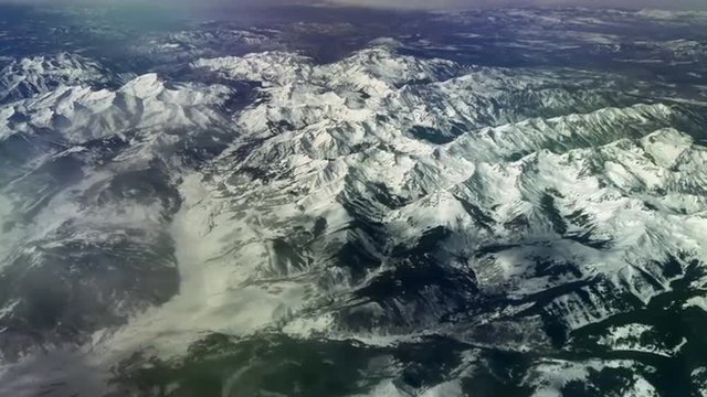 Aerial view over snow-capped Rocky Mountains, 4K