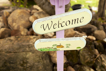 Welcome sign with space on rock background