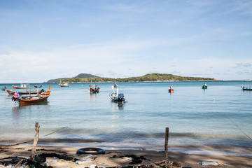 Fototapeta na wymiar Longtail fisherman boat on the beach, rawai beach, Phuket Thailand