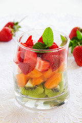 Fruit salad of strawberries, kiwis and apricots.