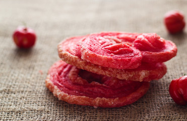 Red flavour  fried puff on brown sack, soft focus