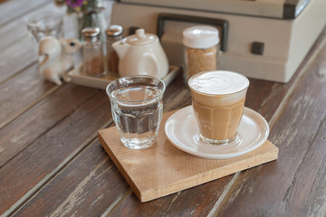 cup of coffee on wooden table : Selective focus