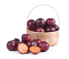 Sweet ripe cherry in the basket on white background