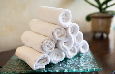 Fototapeta na wymiar rolled bath towels at hotel spa