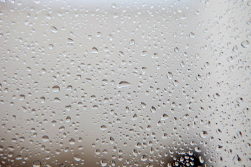 Photo of a glass full of water drops