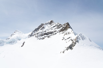 Fototapeta na wymiar Jungfrau Alpine Alps mountain landscape at Jungfraujoch, Top of