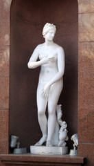 statue of a naked girl on a historic