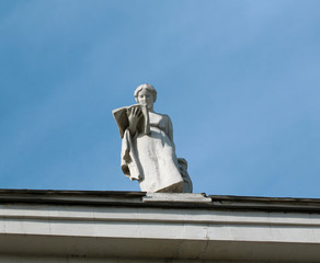 Statue of a girl on a building in downtown Moscow