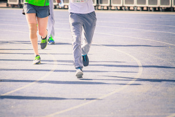 Fototapeta premium marathon of blurred motion crowd people jogging outdoor