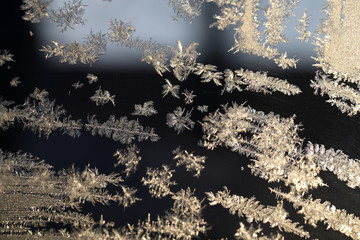 Snowflakes frozen glass