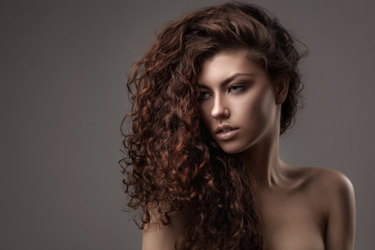 Woman With Healthy Brown Curly Hair