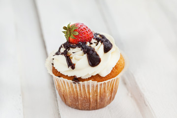 Delicious cream and strawberry cupcakes