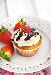 Delicious cream and strawberry cupcakes