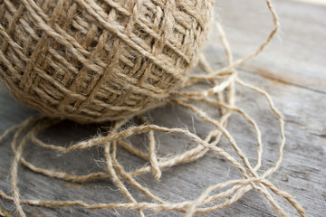 wool ball of threads on wooden table