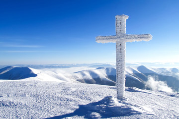 snow-covered cross
