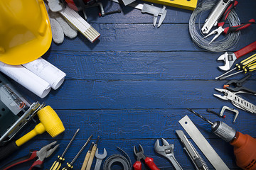 Construction Tools on Blue Wood  