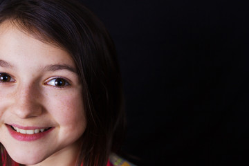 Smiling Happy, little girl, looking at camera wearing glasses.Close-up Studio Portrait