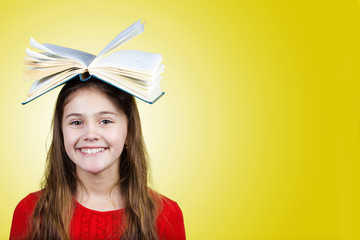 Smiling Portrait of a cute little schoolgirl loving to learn 
