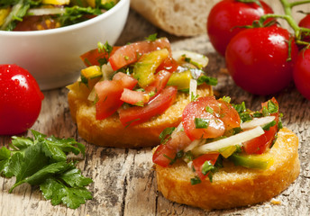Italian bruschetta with tomato, onion and bell 