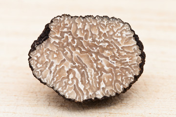 Black Truffle (on Wooden Cutting Board)