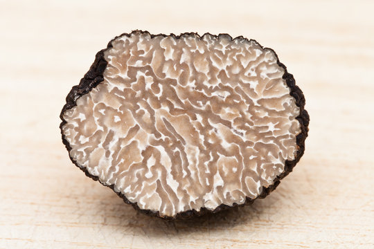 Black Truffle (on Wooden Cutting Board)