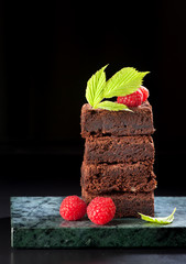 Chocolate cake brownies with raspberries
