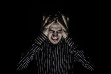 Screaming Stressed, aggressive portrait of a young student, man