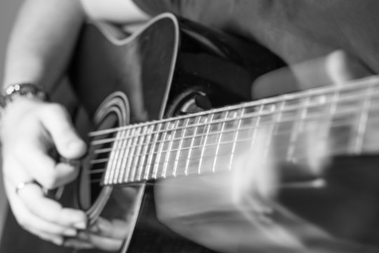 guitar player slides on frets