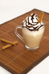 Iced coffee with foam and cinnamon