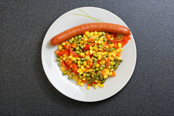 Fried mixed vegetables and sausage