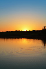 Naklejka na ściany i meble Beautiful sunset over Lake