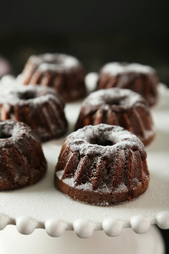 Chocolate Bundt Cakes On Cake Stand On Black Background