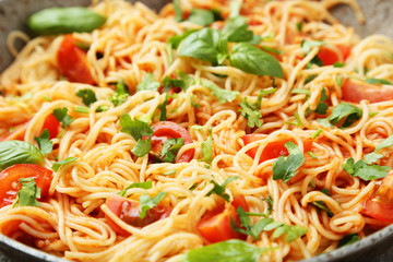 Spaghetti with tomatoes and basil