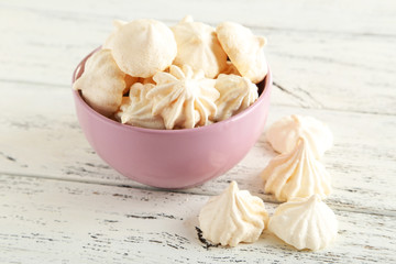 French meringue cookies on white wooden background