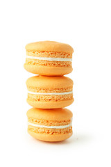French orange macarons isolated on white