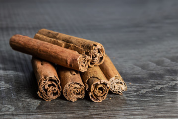 Cinnamon sticks isolated on brown wooden background