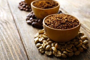Various of coffee in small dishes on wooden background