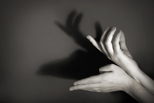 Hands gesture like deer on gray background