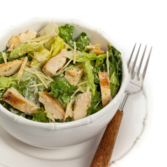 Chicken Caesar Salad on white background. Selective focus.
