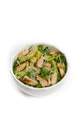 Chicken Caesar Salad on white background. Selective focus.