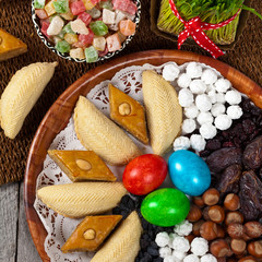 Novruz in Azerbaijan. Colored eggs for easter and traditional sweets