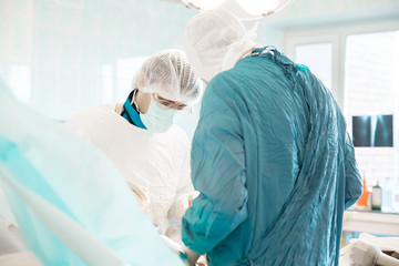 two surgeons doing operation