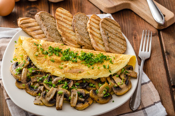 Rustic omelette with mushrooms on chives